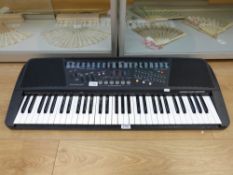 A 'Concertmate 1000' electronic keyboard with five octaves, 100 rhythms and 100 sounds,