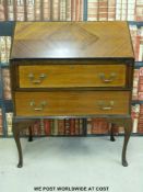 A quarter veneered bureau raised on cabriole legs (w75 x d41 x h97cm)