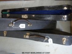 Two violin cases together with a ukulele and banjo case