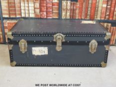 A vintage lockable travelling trunk with key,