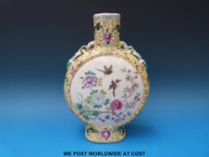 A 19thC Chinese famille jaune moon flask with bird and floral decoration on a yellow ground and
