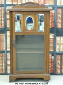 A late 19thC music cabinet with three bevelled edge mirrors to the top section of door (w55 x d35 x