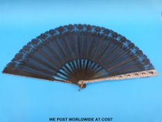 A large 19thC sequinned lace fan with painted carved bone sticks,