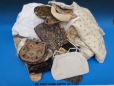 A quantity of textiles to include a collection of gloves, vintage bags to include beaded,
