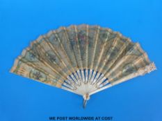 A 19thC mother-of-pearl inlaid carved bone fan with hand decoration of flowers with sequinned