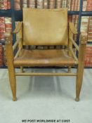 A leather seated retro armchair and tilting back