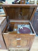 A wind up gramophone with internal horn together with a quantity of 78 records