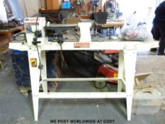 An 'Axminster' bench wood turning lathe on stand with accessories