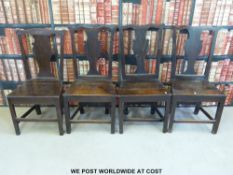 A set of four Georgian solid seat oak dining chairs