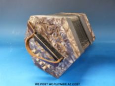 A Saxony-made Anglo concertina with 21 buttons in D/G in grey pearloid finish