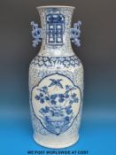 A large Chinese blue and white twin-handled vase decorated with butterflies and flowers (56cm tall)