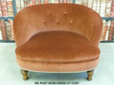 A small button-backed nursing chair raised on turned legs