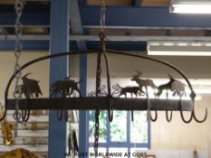 An oval meat or similar country kitchen hanging rack,