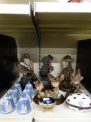 A collection of Resin bird figures,