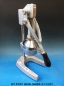 A retro OrangeX large citrus juicer,
