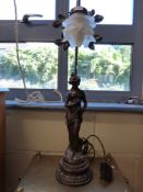 A decorative figural bronze-style table lamp with floral glass shade (height 66cm)