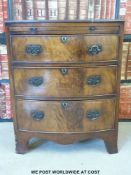 A bow-fronted chest of three graduated drawers with brush slide,