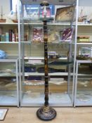 A Chinese lacquer standard lamp with figural decoration raised on a circular base (178cm tall)