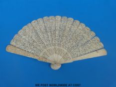 A 19thC Chinese deeply carved ivory brisé fan