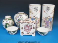 A collection of Chinese ceramics to include a pair of cylindrical vases decorated with figures and