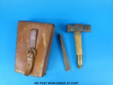 A leather cased campaign, geological or fossil hunting hammer and chisel set,