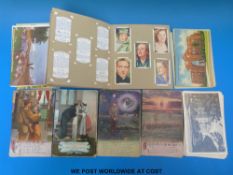 A collection of postcards including Norfolk, America, Gambia,