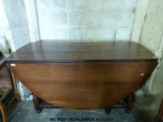 An antique oak gateleg table of peg jointed construction (length 148cm)