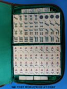 A Mah Jong set and a hardwood domino set,