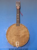 A c1930 Savana ukulele banjo with inlaid decoration around head,