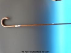 A Swaine Adeney hallmarked silver collared walking stick,