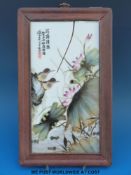 A 20thC Chinese porcelain plaque of birds amongst pond life (24 x 121cm)