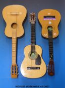 Two six-string children's size acoustic guitars by Skylark together with another example and one