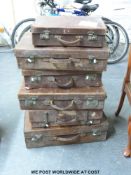 Six vintage mainly leather suitcases (largest approximate w67cm)