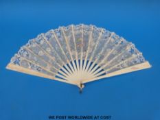 A 19thC carved and pierced bone fan with hand-painted detail of butterflies amongst forget-me-nots