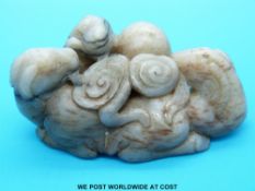 A Chinese jade carving of various horses and lingzhi (9.