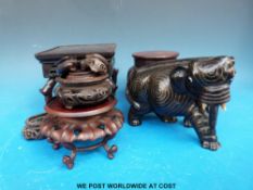 A collection of 18th/19thC Chinese rosewood stands and an inlaid silver Chinese rosewood elephant