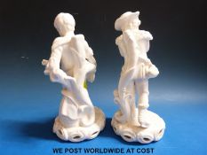 A pair of late Stevenson & Hancock Derby blanc de chine figures, one a young man on skates,