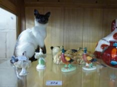 A collection of ceramics to include a large Beswick Siamese cat, Staffordshire dogs, Poole vase,