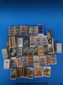A collection of cigarette cards in packets, some full sets, including loose Ogdens film stars etc,