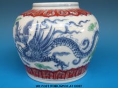 A Chinese ginger jar decorated with dragons (11cm diameter)