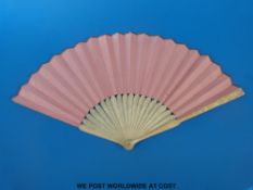 A 19thC carved ivory continental fan with decoration of Diana bathing with Acteon observing,