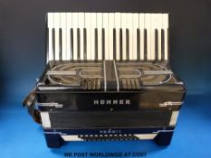 A Hohner 48 bass Verdi I piano accordion in black finish with case