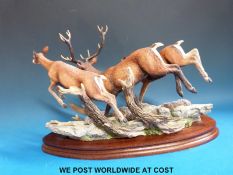 A Border Fine Arts limited edition figure of deer 'Highland Chase' by R J Roberts on wooden plinth,