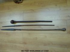 A vintage knobkerrie (75cm long) and two African spears with leather bindings,