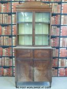 A 19thC satinwood secretaire bookcase, the glazed top section with adjustable shelves,