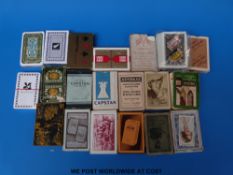 A tray of largely advertising playing cards (shipping lines,