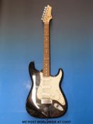 An AXL Player de Luxe electric guitar with case