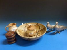 A collection of studio pottery together with a pair of silver plated pheasants and an unusual