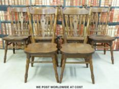 A set of six oak chairs with stick backs