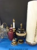 A modern standard lamp together with five various other lamps